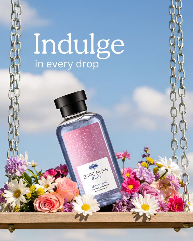 Costak Bottle of Bare Bliss Blue shower gel on a swing with flowers and a blue sky background