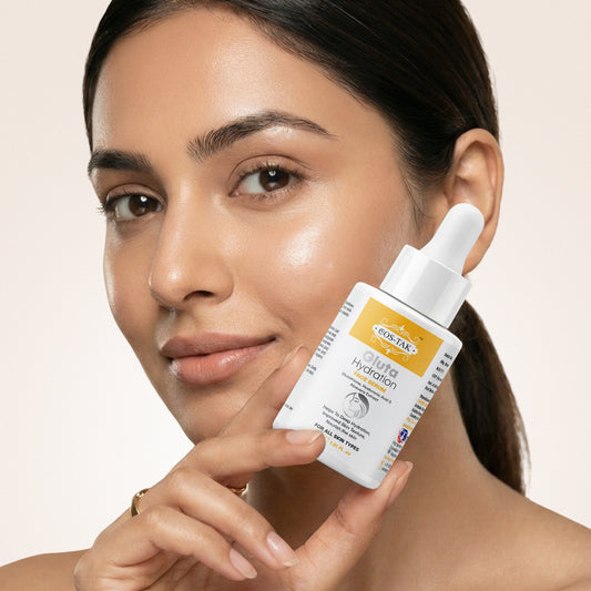Costak Woman holding a skincare product with a beige background