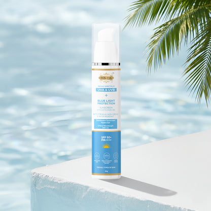 Costak Sunscreen bottle with palm leaves and water in the background
