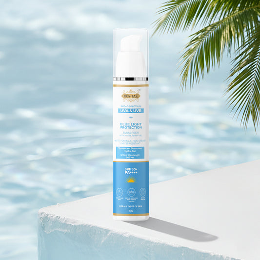 Costak Sunscreen bottle with palm leaves and water in the background