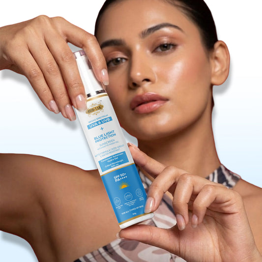 Woman holding a skincare product with blue light protection label